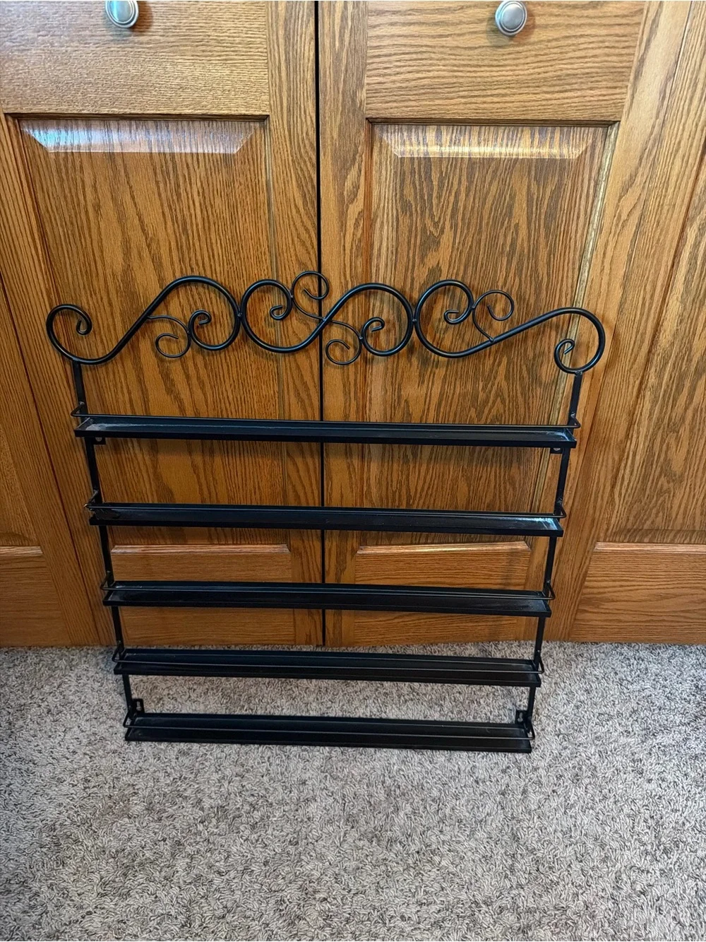 Black Metal Wall Nail Polish Shelf with Decorative Scroll Top